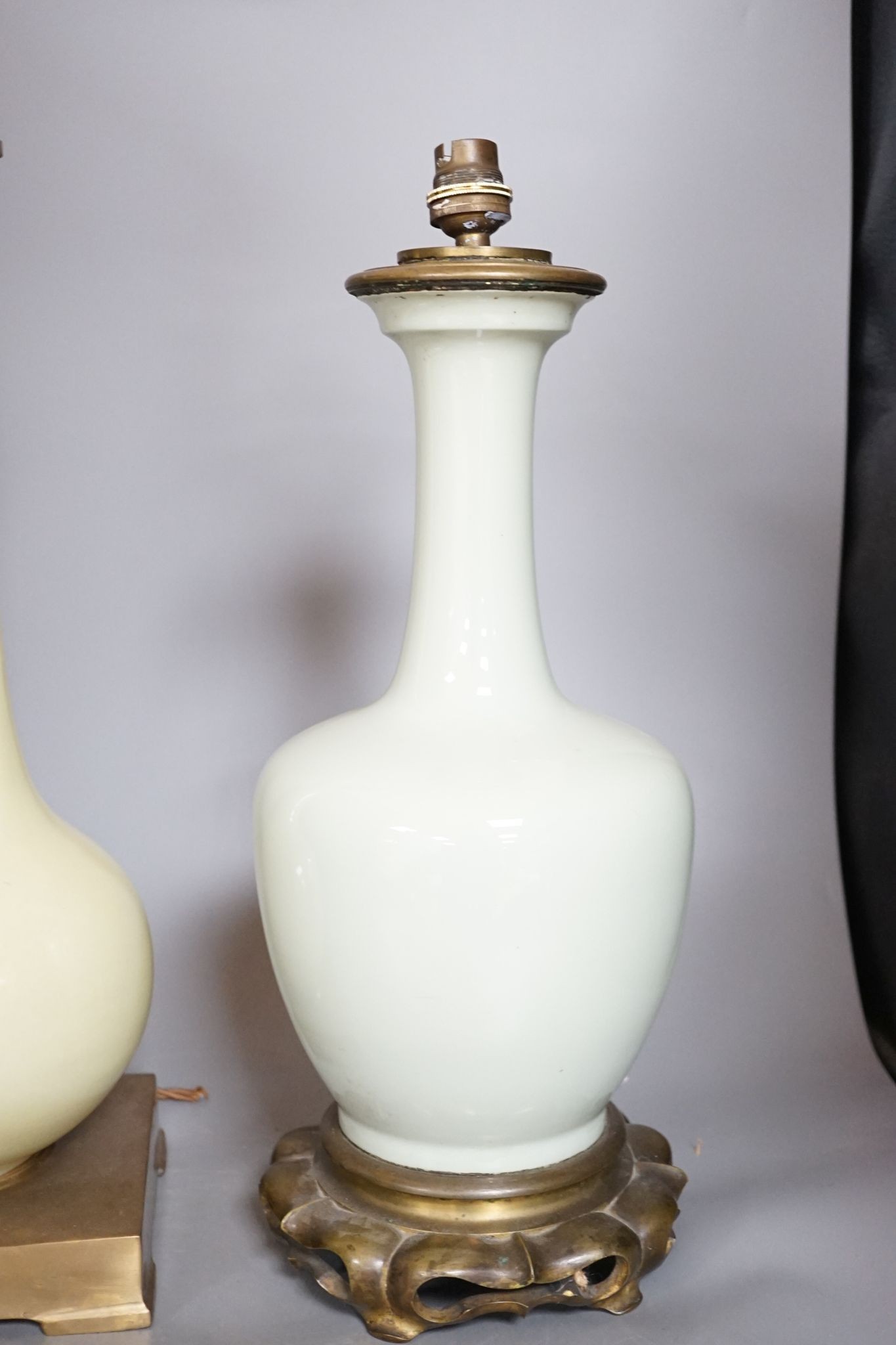 Two Chinese celadon glazed converted lamps, 44cm